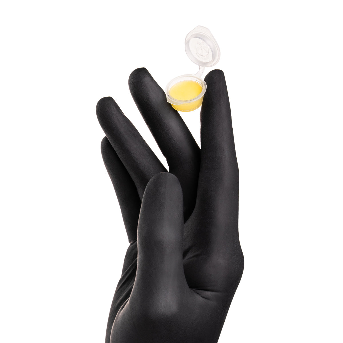 PhiAcademy Skin Candy Monodose Balm 1ml 50pcs — monodose balm portion held in a gloved hand