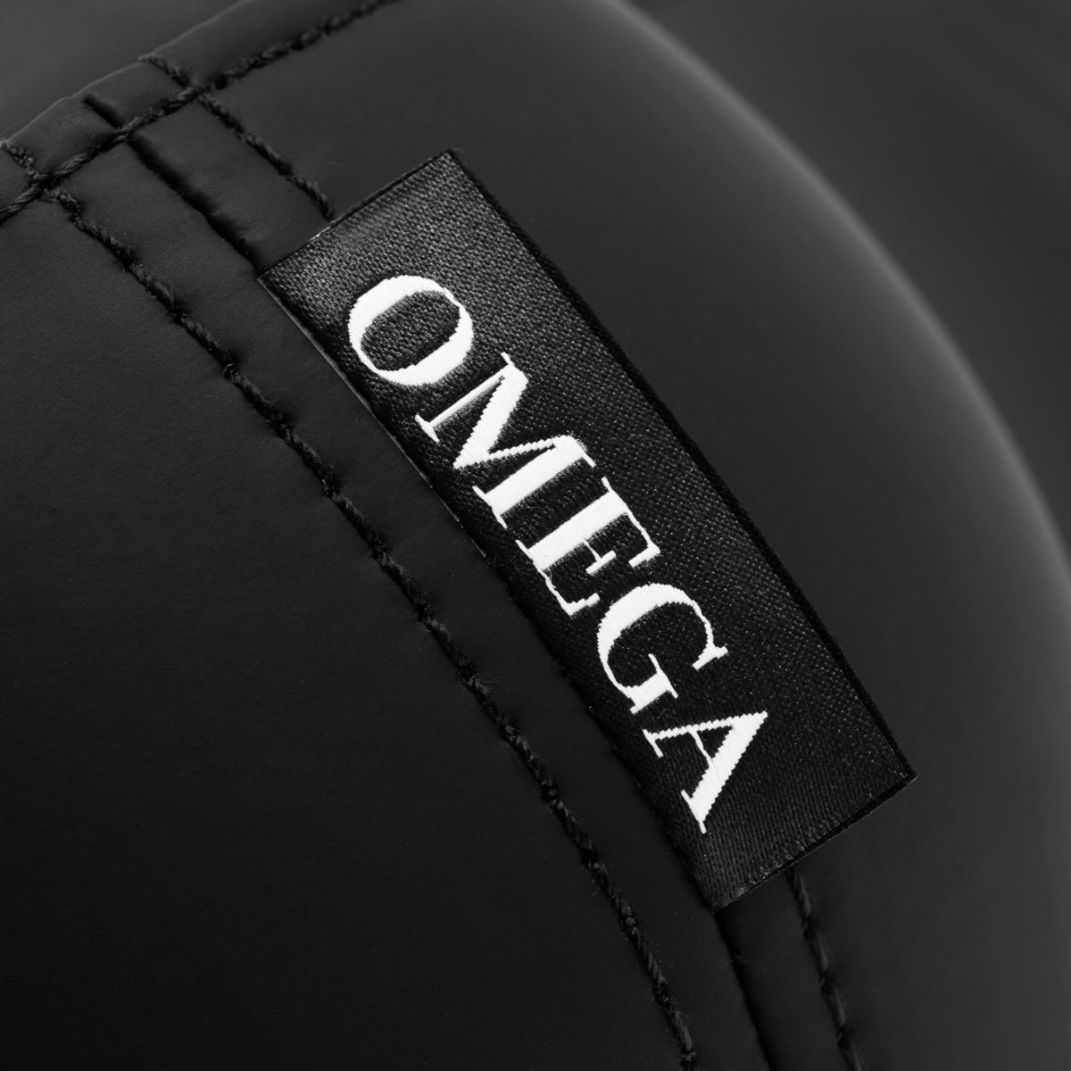 Black Omega Supremo swivel stool with a modern design and adjustable height, featuring a cushioned seat and sturdy base.