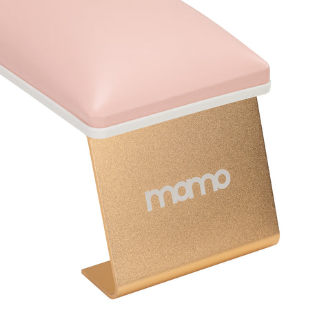 Pink manicure support table from MOMO, a beauty salon furniture piece designed for professional nail treatments.