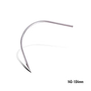 Close-up of BVShop precision straight and curved piercing needles arranged for professional body piercing procedures.