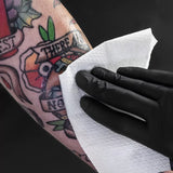 Unistar Nebula tattoo paper towel wipes, 100-pack, soft disposable wipes for tattoo aftercare and cleaning.